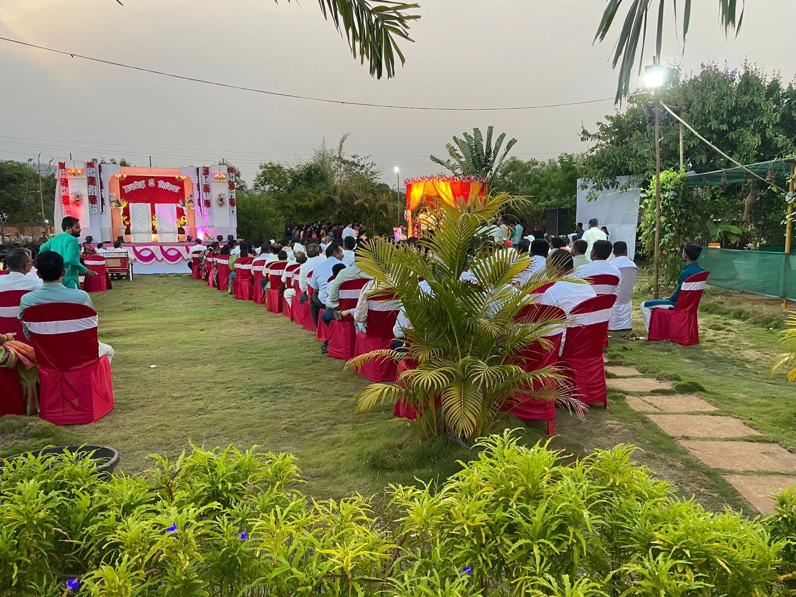A garden aisle and guest seating at Raigad Agro Park