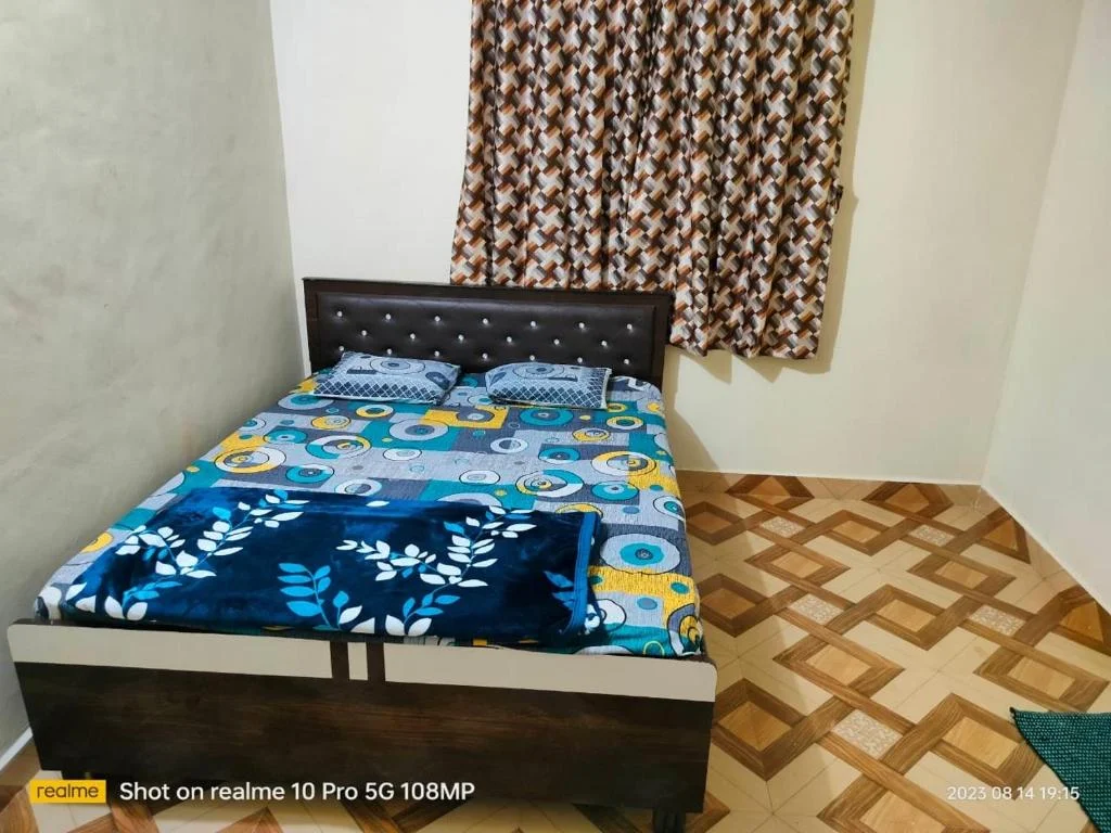 Standard Double Room with Fan at Raigad Agro Park, photographed on the property listing